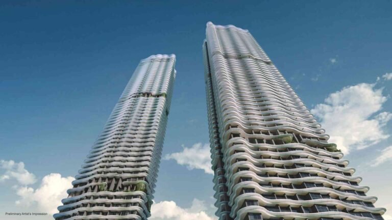 Artist’s impression of Zyon Grand’s iconic twin residential towers showcasing wave-inspired architectural design against a clear blue sky.