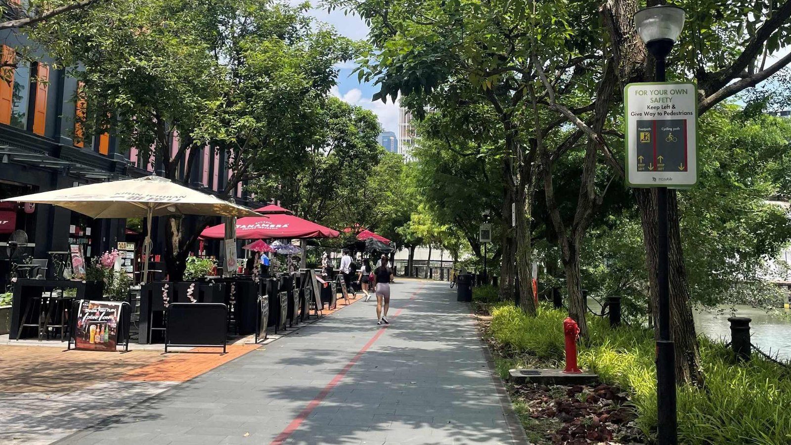 Singapore River promenade near River Valley with shaded walkways and cafés