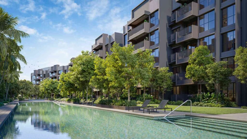 Beautiful resort-style lap pool surrounded by landscaped gardens and modern condo blocks, offering tranquil outdoor living.